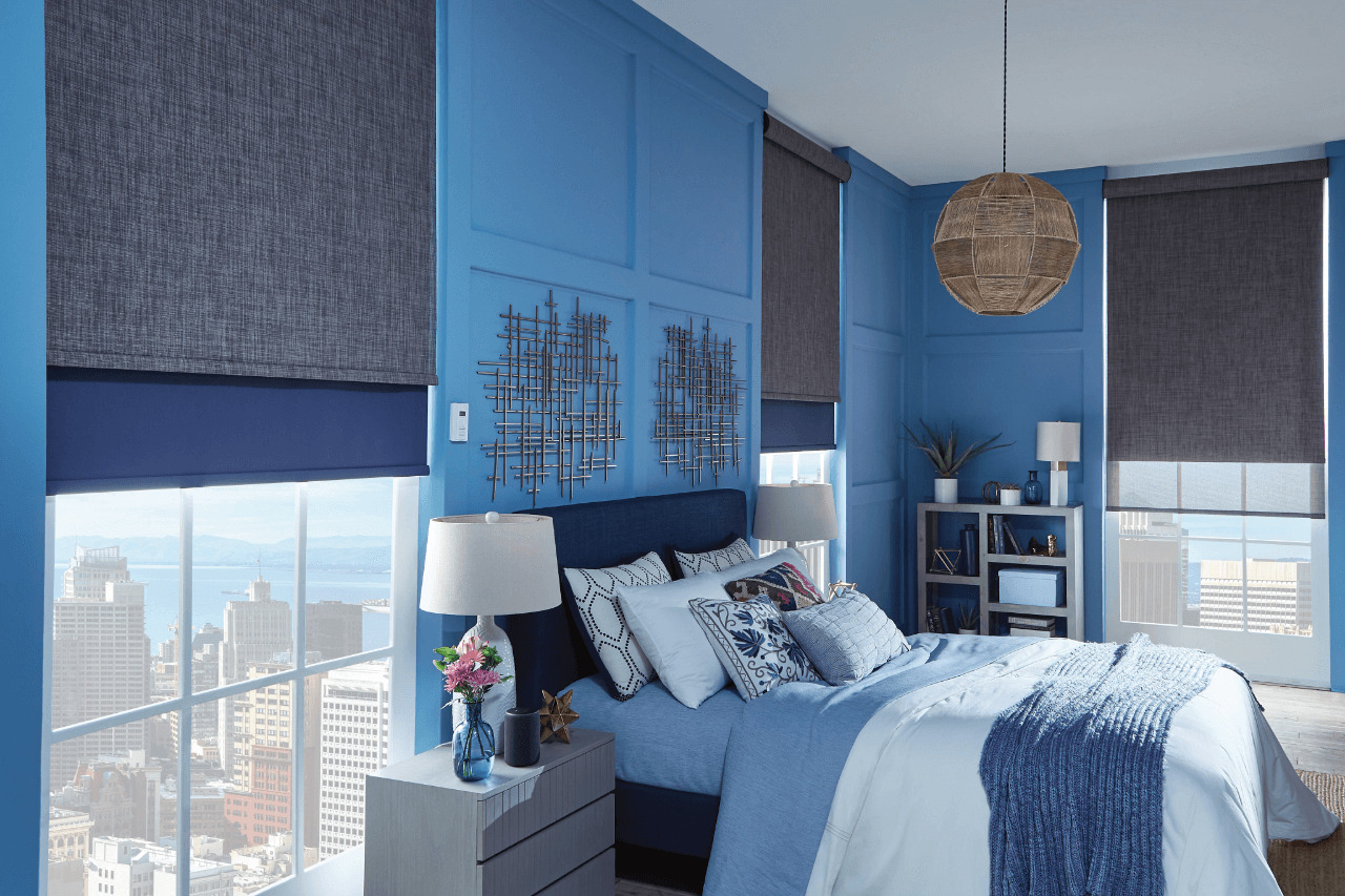 A blue room with gray and blue-themed shades